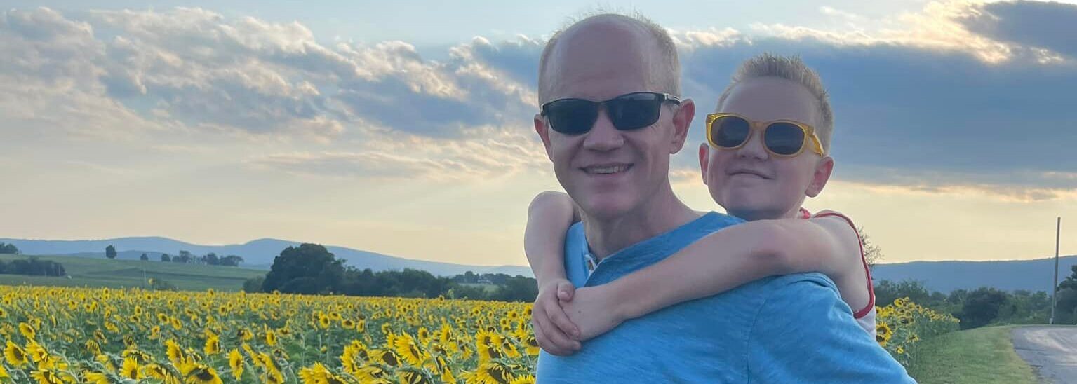 Geoff Brace with his son, Issac, a a beautiful field of sunflowers in Lehigh County.